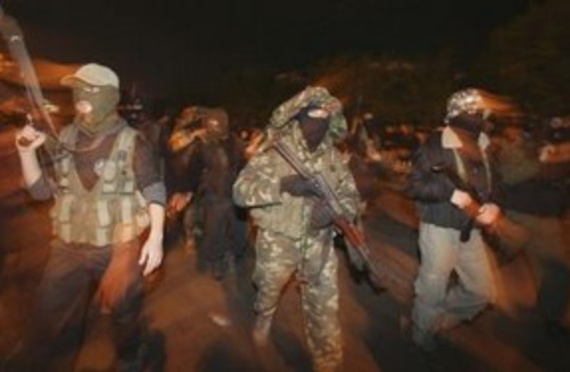 Armed Hamas members celebrate Mubarak resignation 311 R (photo credit: REUTERS/Mohammed Salem)