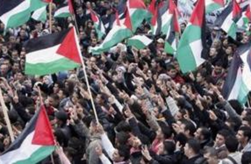 Palestinians in Ramallah rallying for unity 311 R (photo credit: REUTERS/Mohamad Torokman)