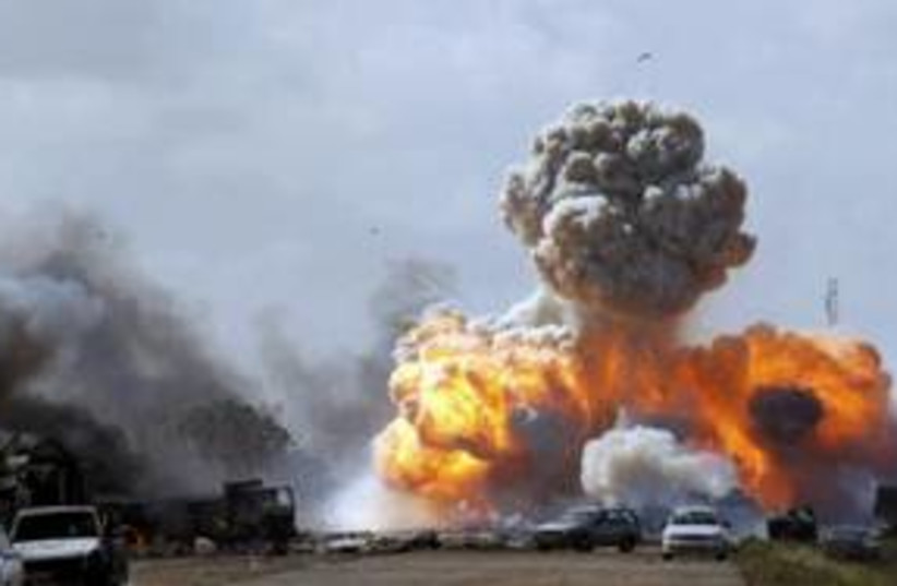 Air strike on Libyan government forces 311 (R) (photo credit: REUTERS/Goran Tomasevic)