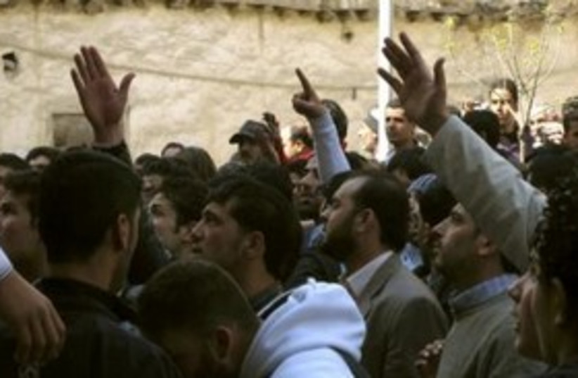 Syrians shout slogans in protests 311 (photo credit: REUTERS/Stringer )