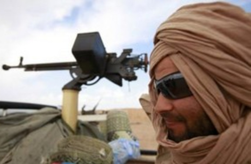 Libya rebel 311 Reuters (photo credit: REUTERS/Andrew Winning)