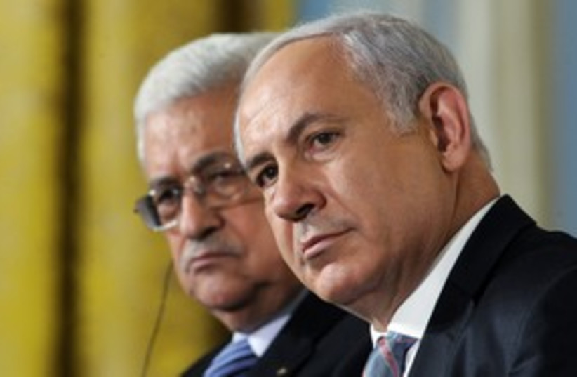 PA President Abbas with PM Netanyahu 311 (R) (photo credit: Jonathan Ernst / Reuters)