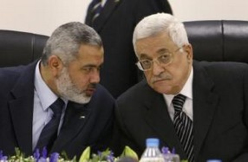 PA President Abbas with Hamas PM Haniyeh 311 (R) (photo credit: REUTERS/Suhaib Salem)