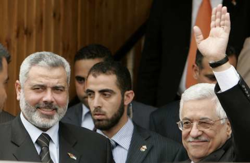 Haniyeh  and Abbas waving 521 (photo credit: REUTERS)