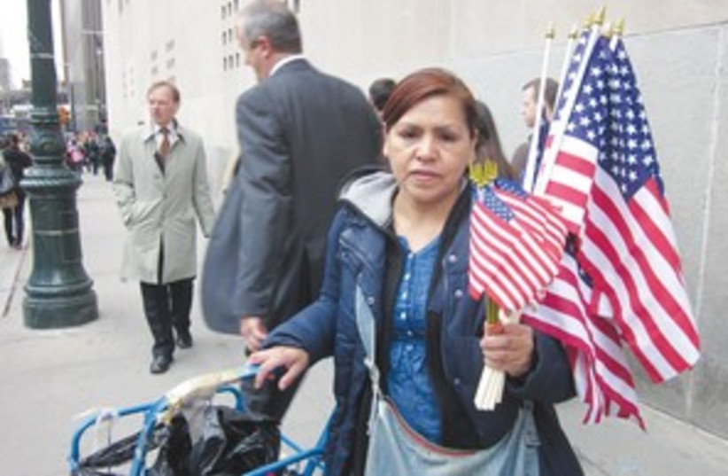 woman holds US flags_311 (photo credit: JORDANA HORN)