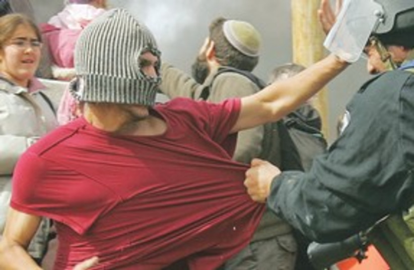 Israeli police scuffle with settlers_311 (photo credit: Reuters)