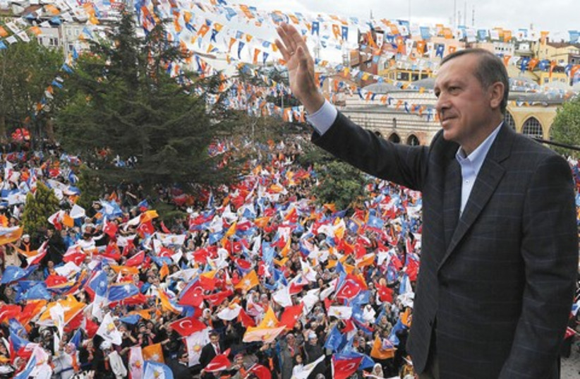Turkish Prime Minister Recep Tayyip Erdogan 521 (R) (photo credit: Reuters)