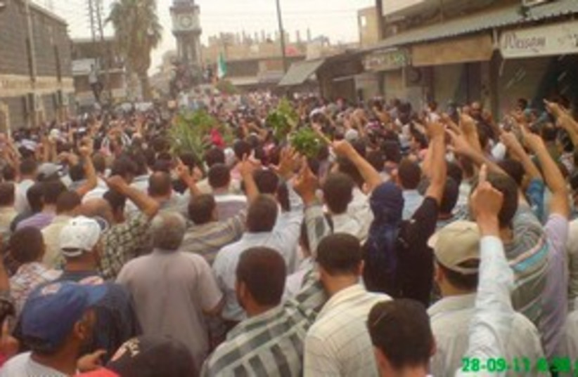 Anti-Assad protesters in Homs 311 (R) (photo credit: REUTERS/Handout)