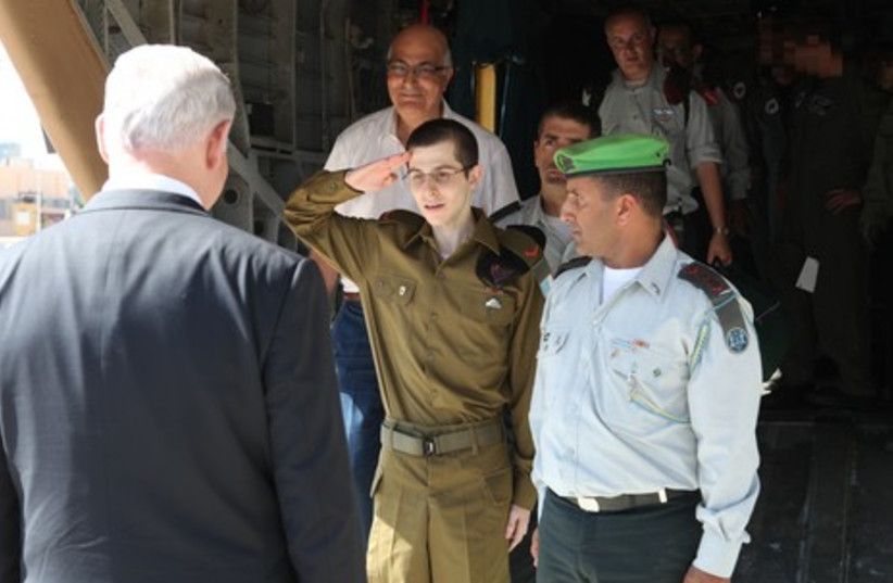 Gilad Schalit saluting  GPO 465 (photo credit: GPO)