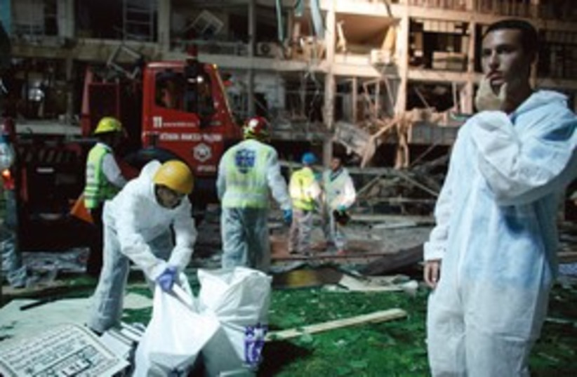 Rescue workers at Netanya gas explosion 311 (R) (photo credit: Reuters)