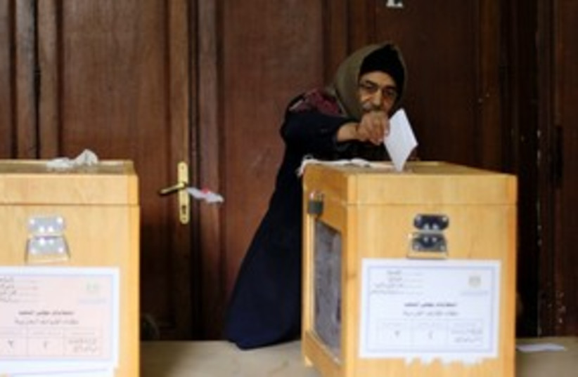Egyptian man votes in  elections 311 (photo credit: Reuters)