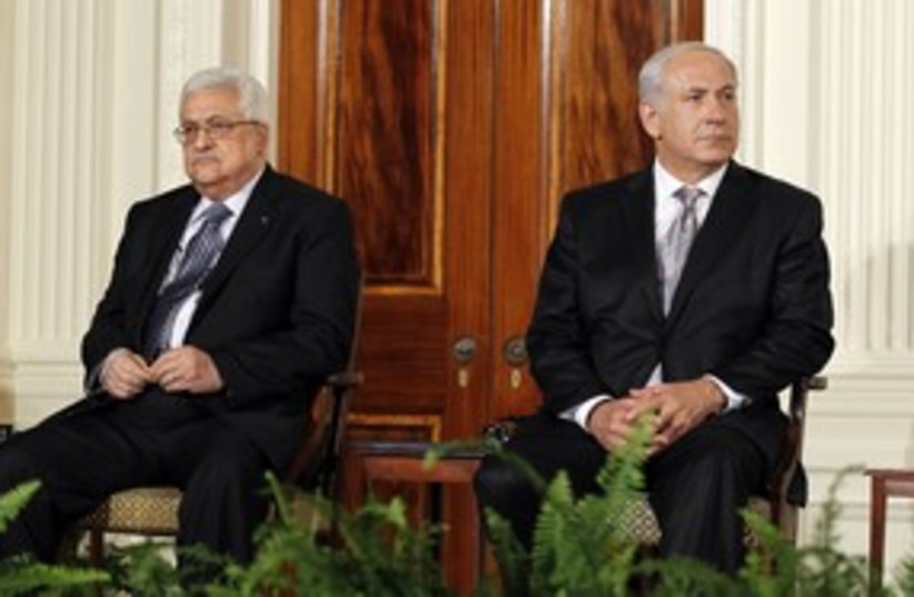 Prime Minister Netanyahu and PA President Abbas 311 (R) (photo credit: Jason Reed / Reuters)