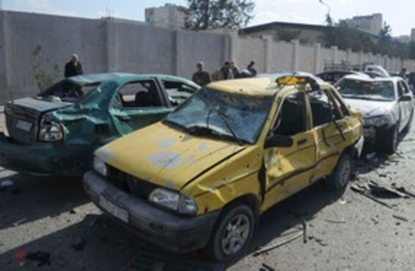 Damaged Syrian cars blast 311 (photo credit: REUTERS/Sana/Handout )