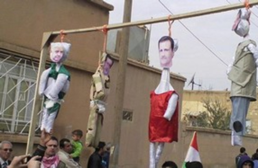 Assad hung in effigy 311 (photo credit: Reuters)