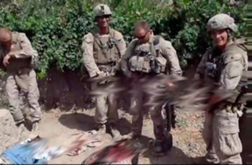 Screencap: Video of Marines urinated on Taliban corpses 311 (photo credit: YouTube )