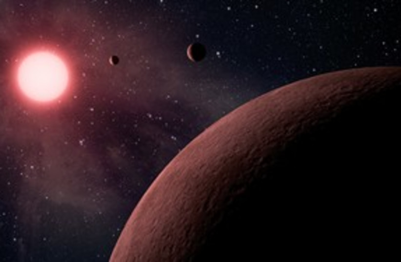 Artist's rendition of exoplanets 311 (photo credit: Astrophysical Journal)