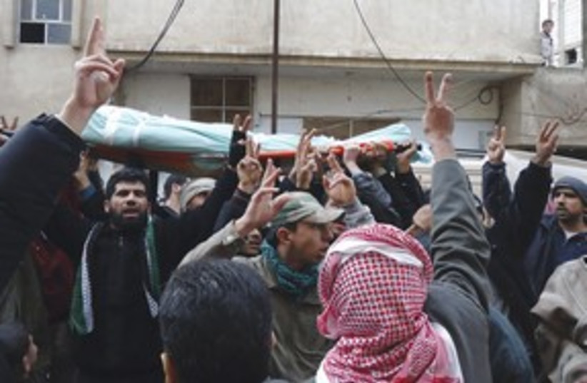 Syrian protestors at a funeral 311 (photo credit: Reuters)