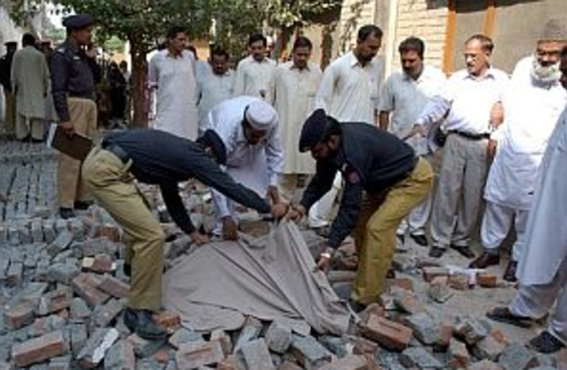 pakistan quake body 298  (photo credit: AP)