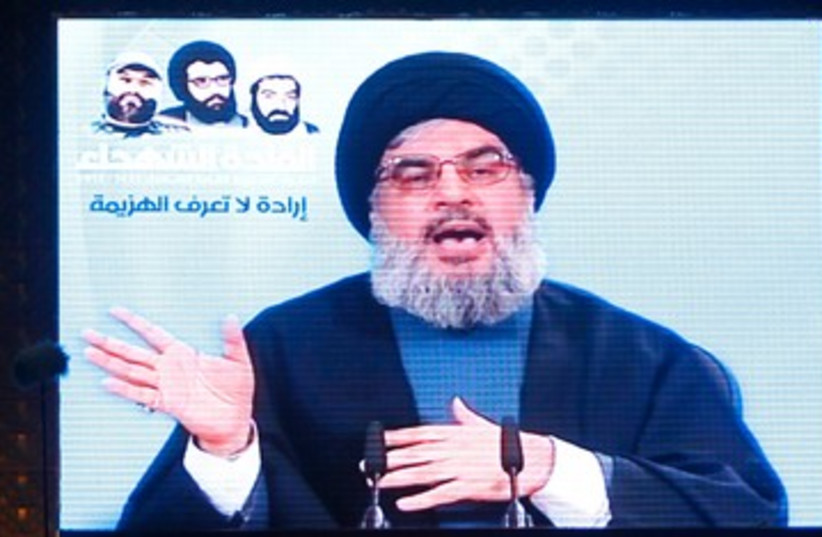 Hezbollah leader Nasrallah speaks to supporters 390 R (photo credit: REUTERS)