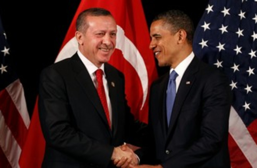 Obama, Erdogan shake hands with flags in background 370 (r) (photo credit: REUTERS/Larry Downing)
