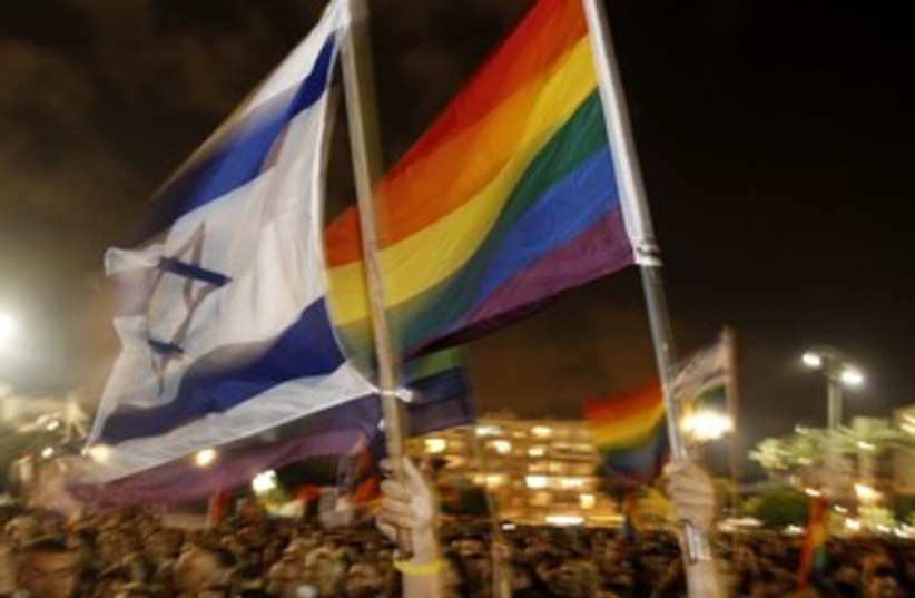 Gay Pride flags 370 (photo credit: Ronen Zvulun / Reuters)