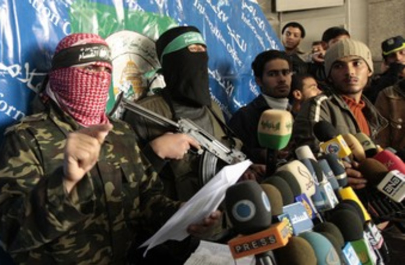 Masked Hamas men hold a press conference 370 (R) (photo credit: Mohammed Salem / Reuters)