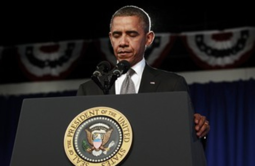 Obama stands for moment of silence 370 (photo credit: REUTERS/Kevin Lamarque)