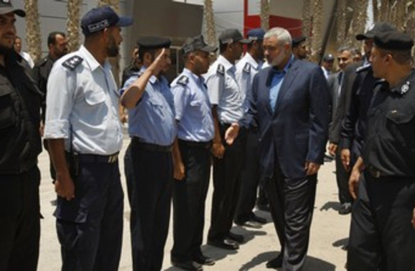 Hamas PM Haniyeh at Rafah before entering Egypt 370 (photo credit: REUTERS/Ibraheem Abu Mustafa)
