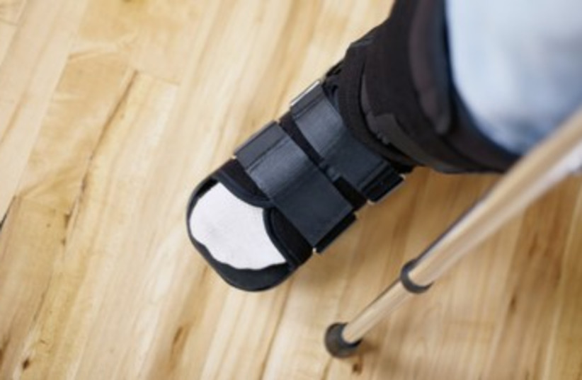 cast limp broken leg crutch injured disabled 390 (photo credit: Thinkstock)