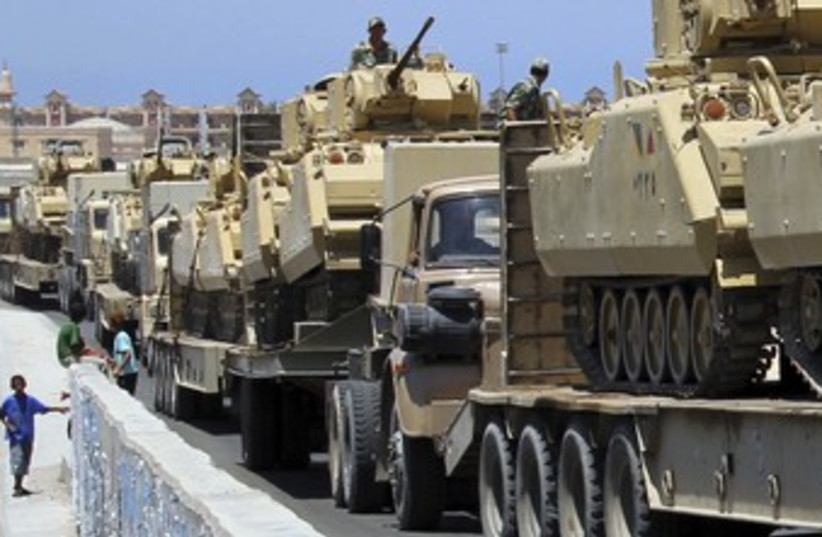 Egyptian tanks arriving in Sinai city of Rafah 370 (R) (photo credit: Mohamed Abd El Ghany / Reuters)