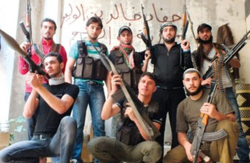 Syrian Rebels in Homs (R370) (photo credit: Yazen Homsy/Reuters)