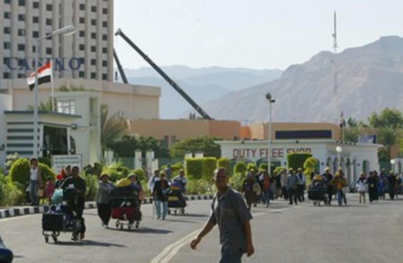 Tourists cross the Egypt-Israel Taba border crossing 370 (R) (photo credit: REUTERS)