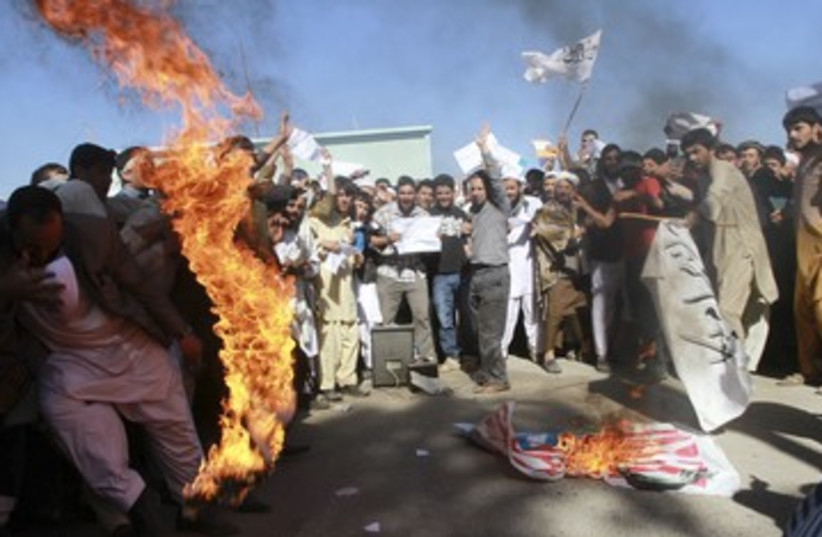 Protesters burn US flag in Afghanistan 390 (photo credit: REUTERS)