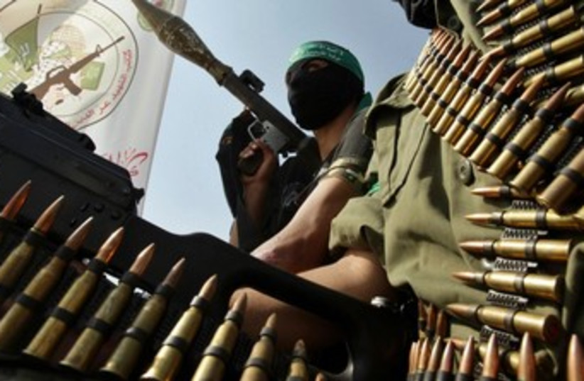 Hamas members take part in a rally 370 (photo credit: REUTERS/Ibraheem Abu Mustafa)