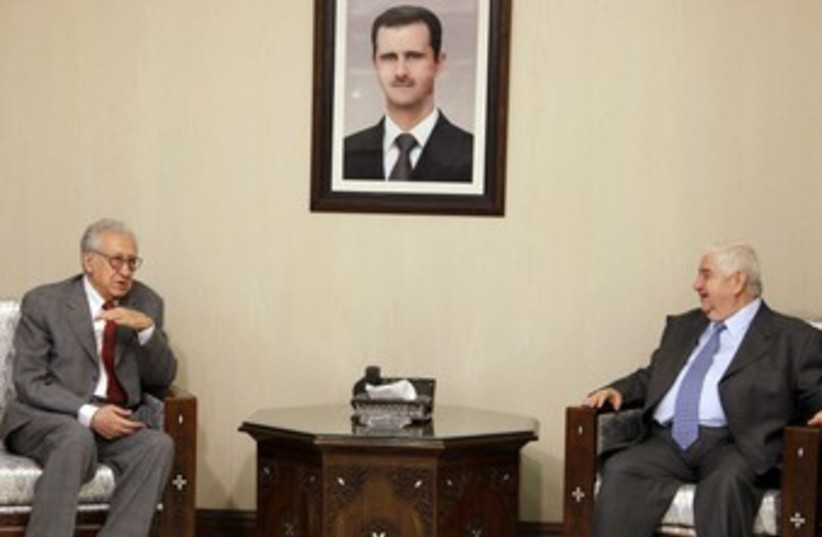 Brahimi and Syrian FM 370 (photo credit: REUTERS/Khaled Al Hariri)