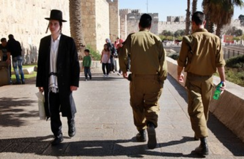Haredi and IDF soldier Tal law Jerusalem 390 (photo credit: Marc Israel Sellem / The Jerusalem Post)