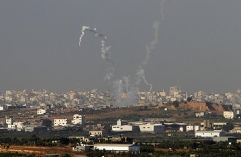 Trails of smoke from Gazan rockets 390 (photo credit: Amir Cohen / Reuters)