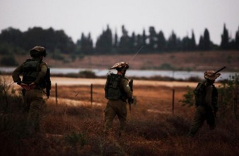 IDF soldiers patrol near Gaza 370 (photo credit: Reuters/Amir Cohen)