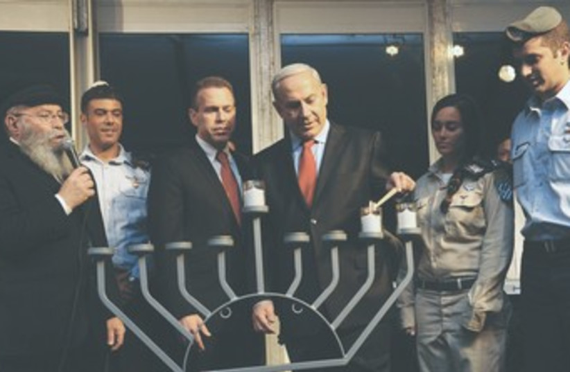 Netanyahu Erdan Hannuka candle 370 (photo credit: Kobi Gideon/GPO)
