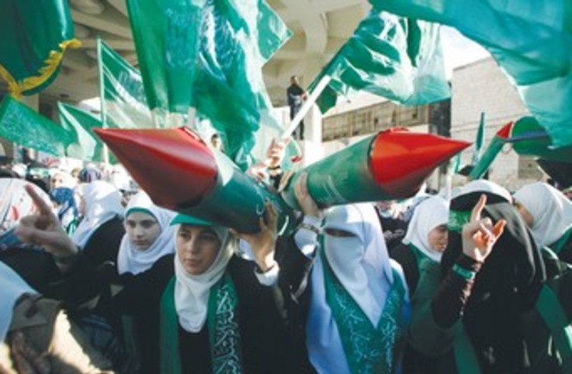 PALESTINIAN WOMEN pose at Hamas rally 370 (photo credit: Muammar Awad/Reuters)