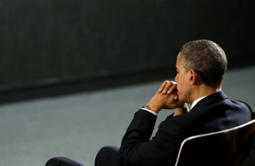 US President Barack Obama, pensive at CT vigil 390 (photo credit: Kevin Lamarque / Reuters)