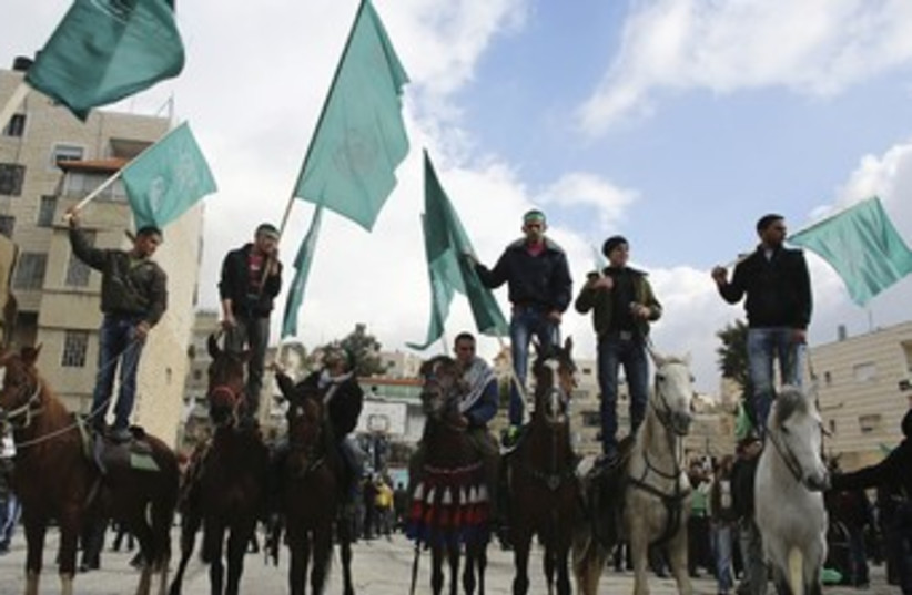 Hamas supporters rally in Hebron 370 (photo credit: REUTERS)