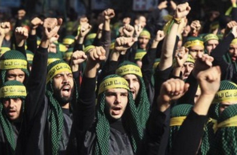 Hezbollah march, fighters 370 (photo credit: Reuters/Khalil Hassan)