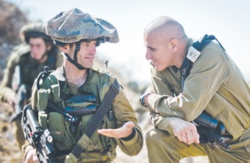 MAJ.-GEN. SAMI TURGEMAN speaks with a soldier 370 (photo credit: IDF Spokesman’s Office)