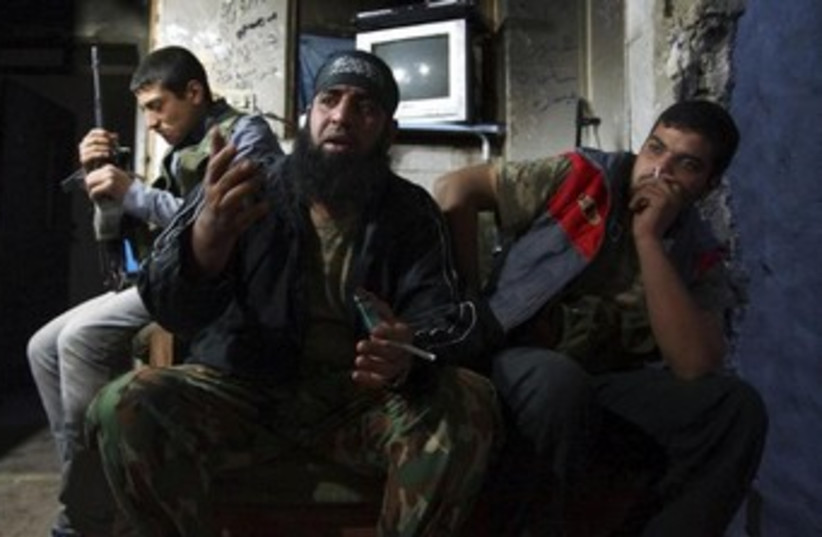 Free Syrian Army fighters 370 (photo credit: REUTERS)