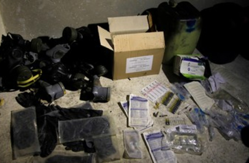 Syria Chemical materials and gas masks 370 (photo credit: REUTERS)