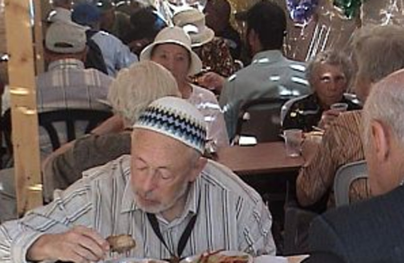 old man eating 298 (photo credit: Revital Aranbaev [file])