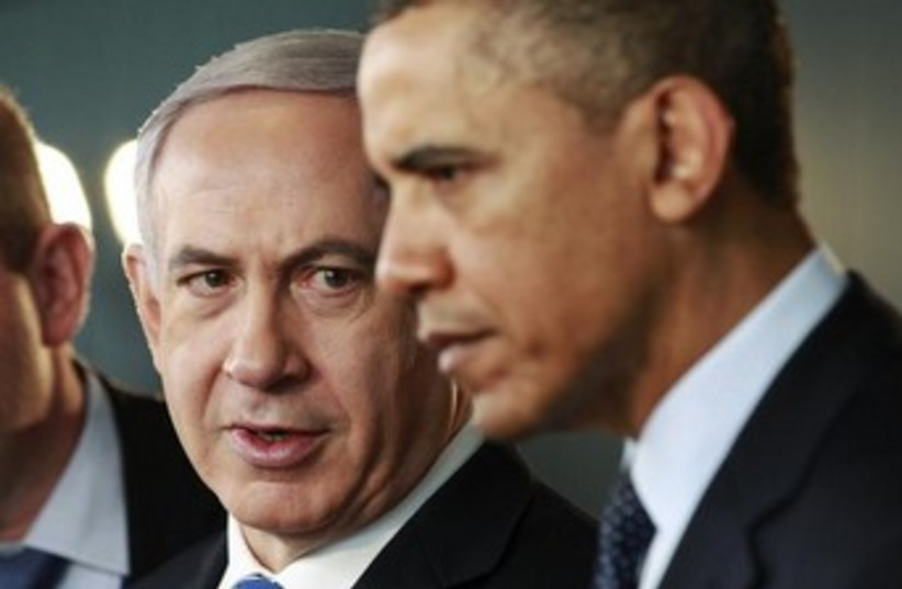 Netanyahu looks at Obama with serious expression 370 (photo credit: REUTERS/Jason Reed)