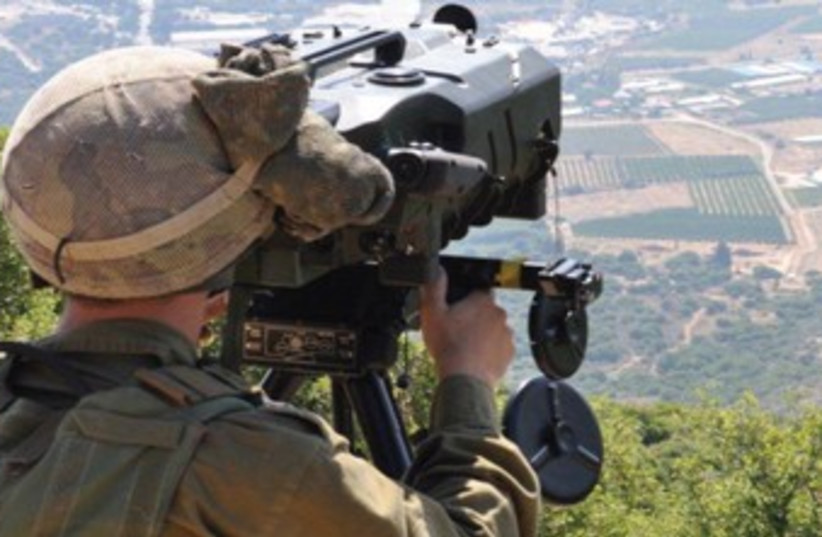A combat intelligence soldier surveying the field. (photo credit: IDF Spokesman’s Office)