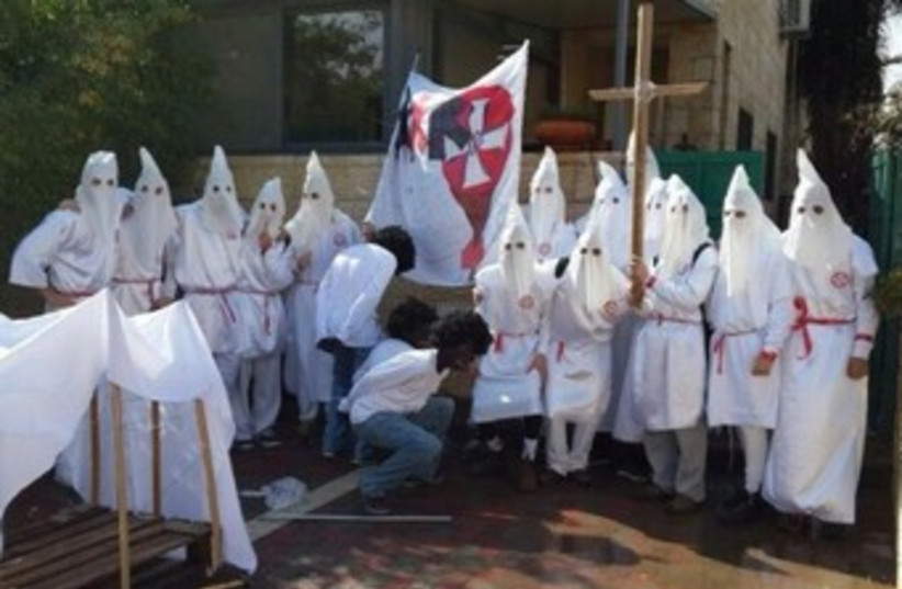 Israel high school students dress up as Klansmen for Purim. (photo credit: COURTESY MIZBALA.COM)
